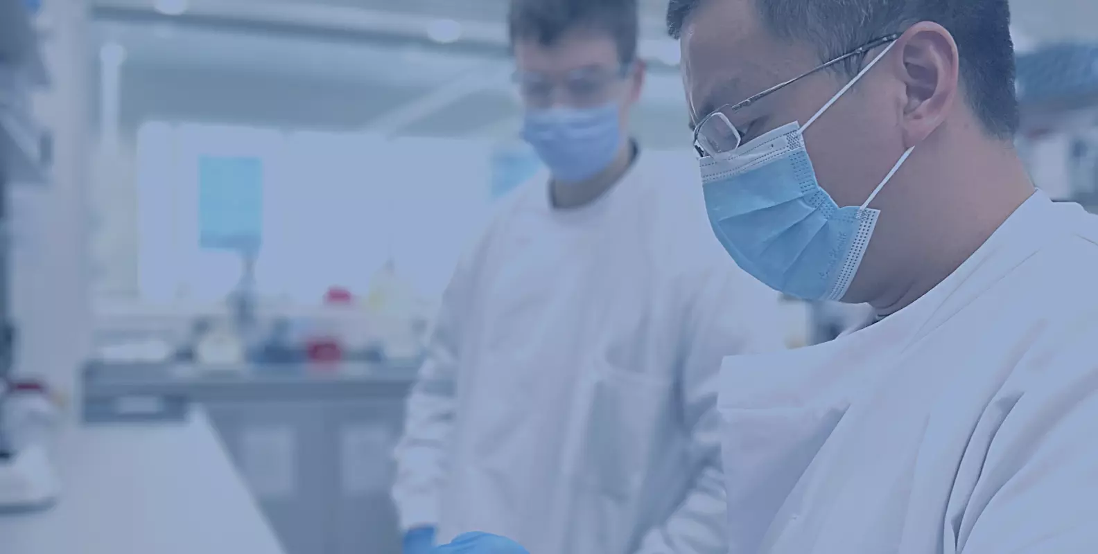 Banner image showing two scientists working together