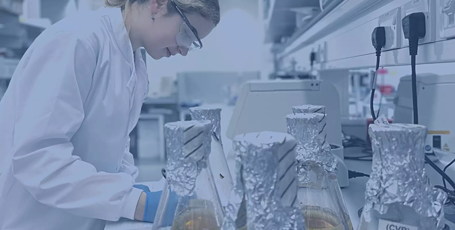 Banner Image showing a scientist working in a lab environment