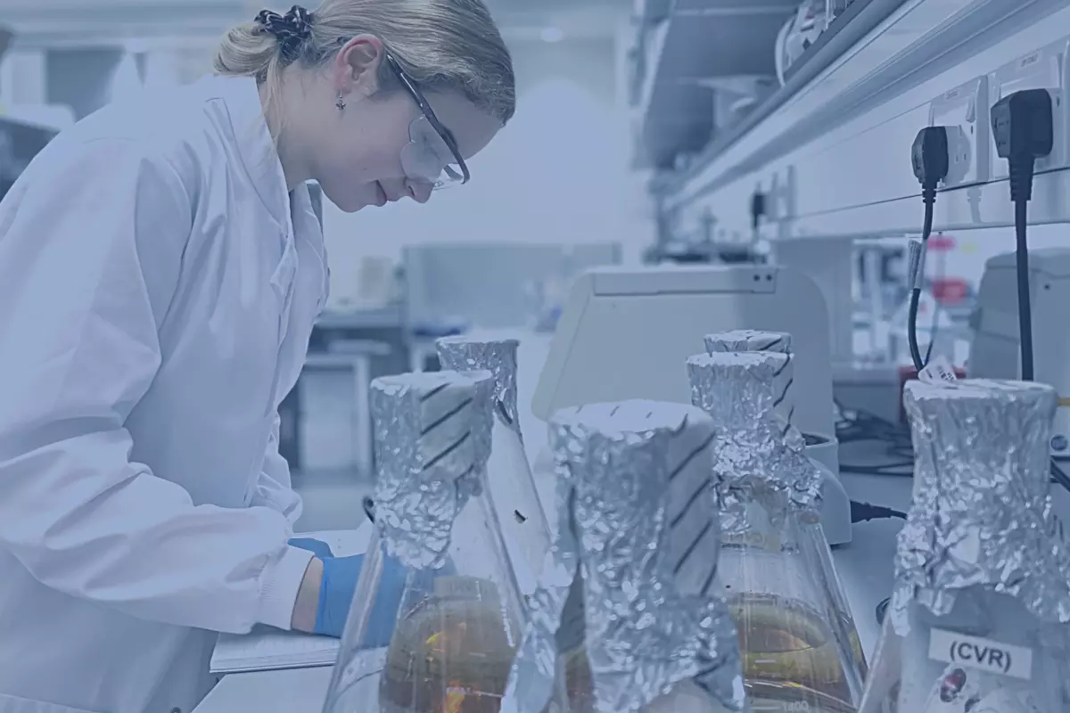 Banner Image showing a scientist working in a lab environment